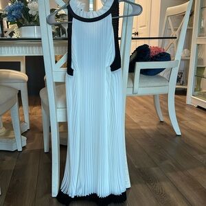 Brand New pleated dress with ruffled pleated collar.